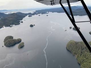 An oily sheen visible around islands in a sound, seen from the air