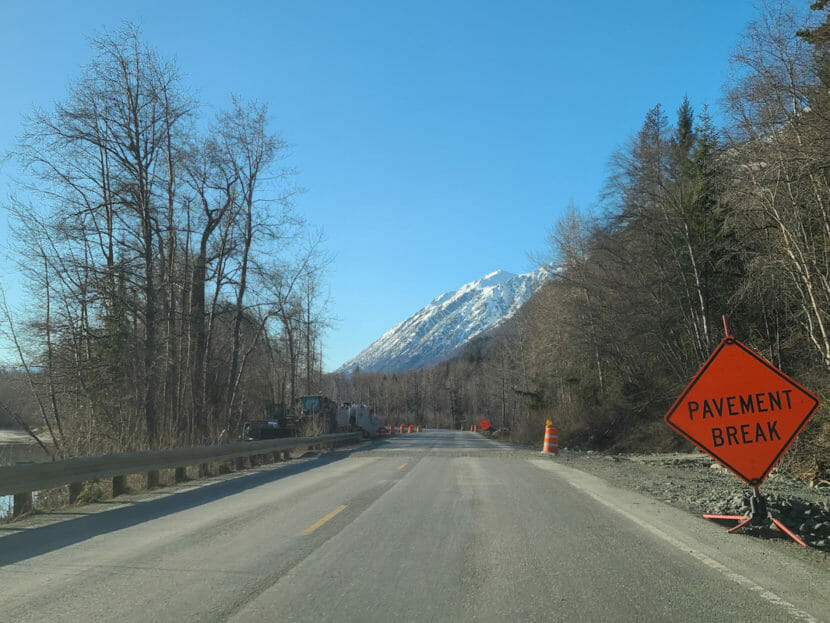 A "pavement break" sign by a rural highway