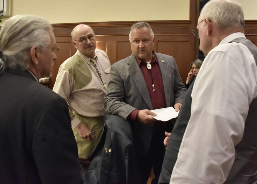 Four legislators on the Senate floor