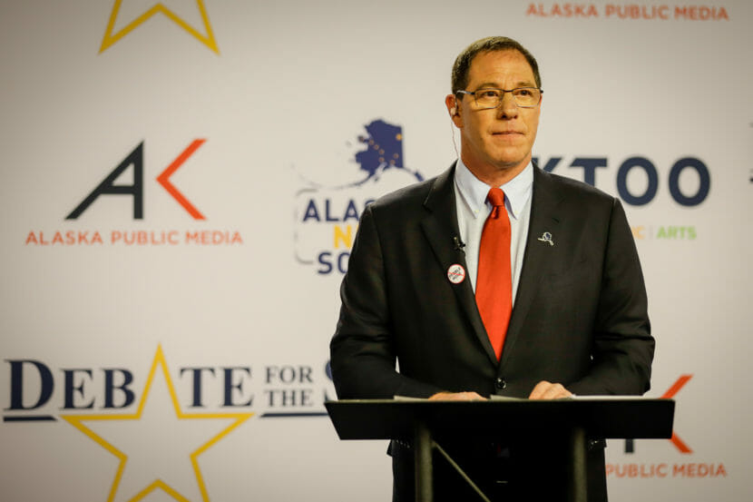 Al Gross stands behind a lectern