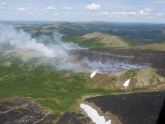An aerial view of smoldering tundra