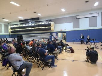 A public meeting in a gymnasium