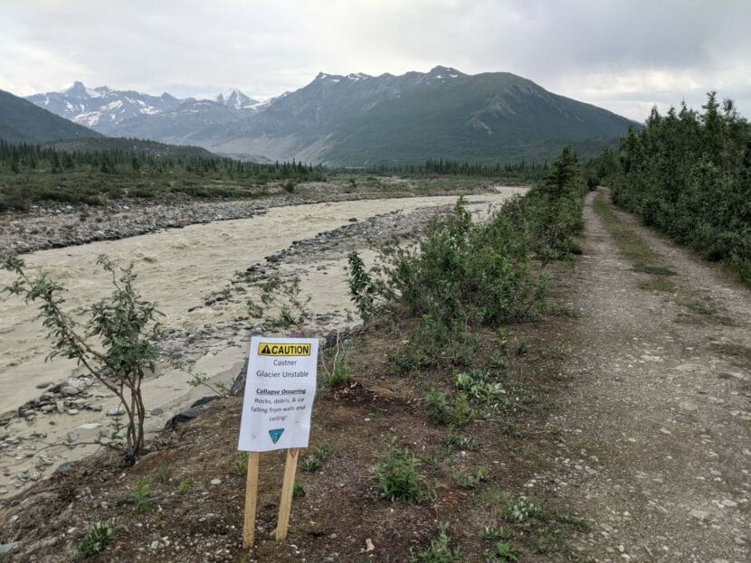 A sign on a trail warning people that the glacier is unstable