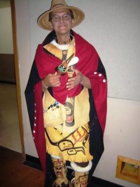 A man dressed in regalia