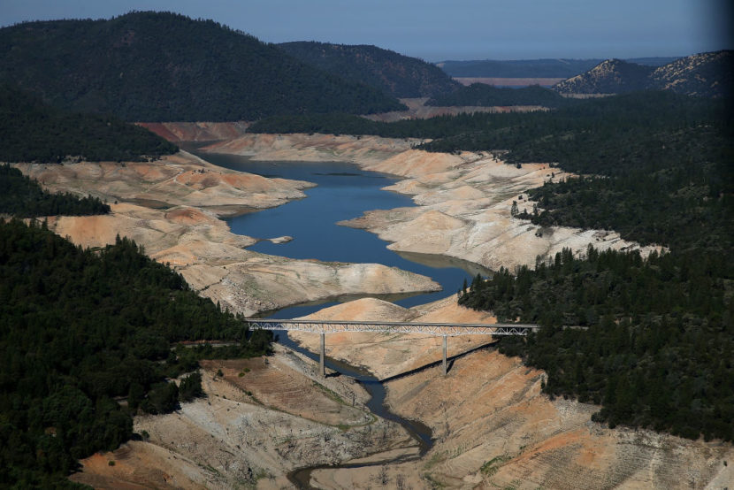 A bridge over a lake that has nearly gone dry
