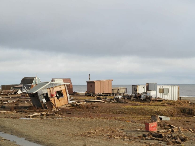 A cluster of camps, one badly damaged, and debris all around