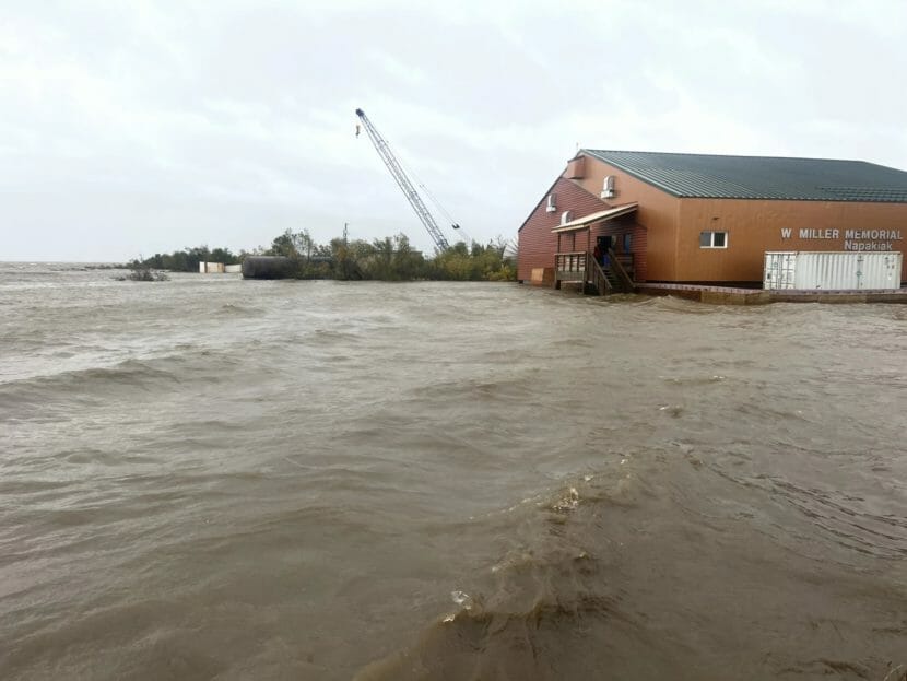 A river flooded over its banks, right up to the front of a school building