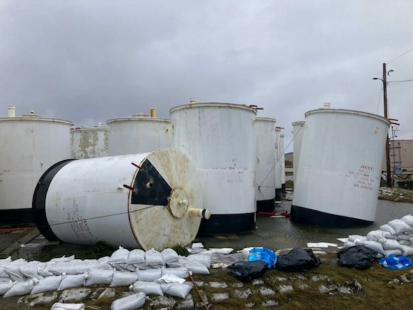 White fuel tanks, some tilted and one tipped over completely