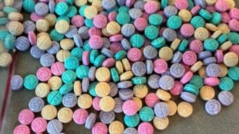 A pile of pills in various colors