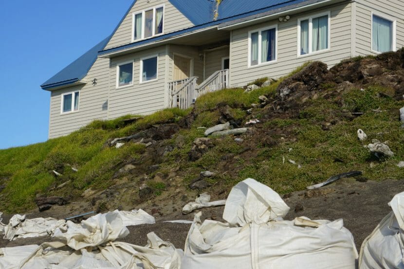 A house at the very edge of a bluff.
