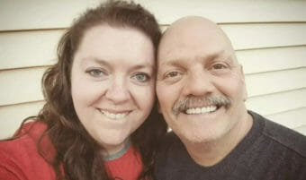 A selfie of a smiling couple.