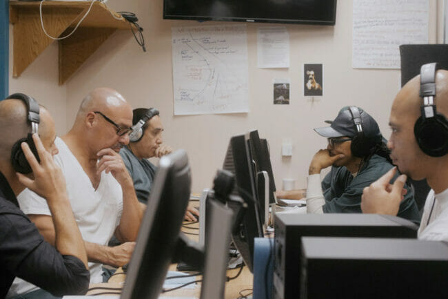 Incarcerated inmates working at computers to learn about operating Inside Wire: Colorardo Prison Radio