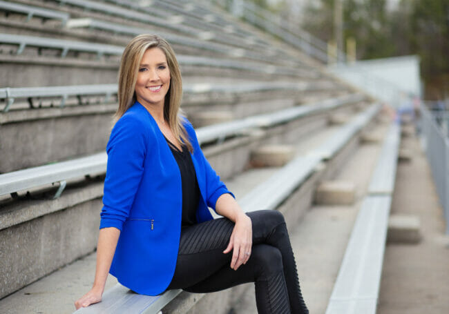Lauren Sisler sitting on some bleachers