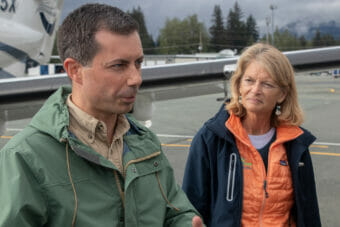 U.S. Secretary of Transportation Pete Buttigieg and U.S. Senator Lisa Murkowski, R-Alaska, speak with reporters at the Juneau International Airport on Wednesday August 16th, 2023 (Mikko Wilson/KTOO)
