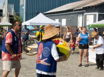 Ellie Jackson (center) leads Kake’s Kéex’ Kwáan dancers. (Photo by Shelby Herbert/KFSK)
