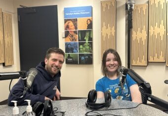Tristan Knutson-Lombardo and Genevieve Coleman from Juneau Nordic Ski Club sitting at the radio table for Juneau Afternoon.