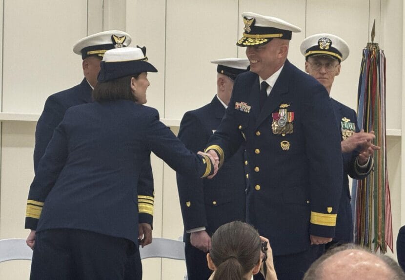 Rear Adm. Bob Little, the new commander of the Coast Guard's Arctic sector, smiles as he shakes hands with Rear Adm. Megan Dean, the departing commanding officer, during a change of command ceremony Friday, July 11, 2025, in Juneau.