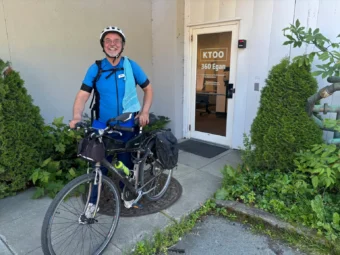 Dr. Craig Davis outside the KTOO studios with his bike. Davis completed is Ride for Peace trip from Prince George to Juneau.
