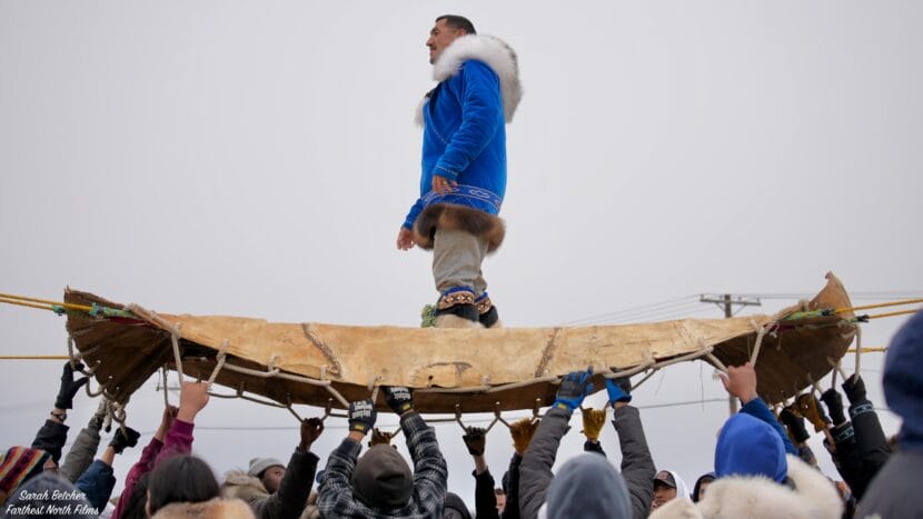 Quincy Adams prepares to jump on a sealskin blanket during Nalukataq festival in Utqiagvik in June, 2025.