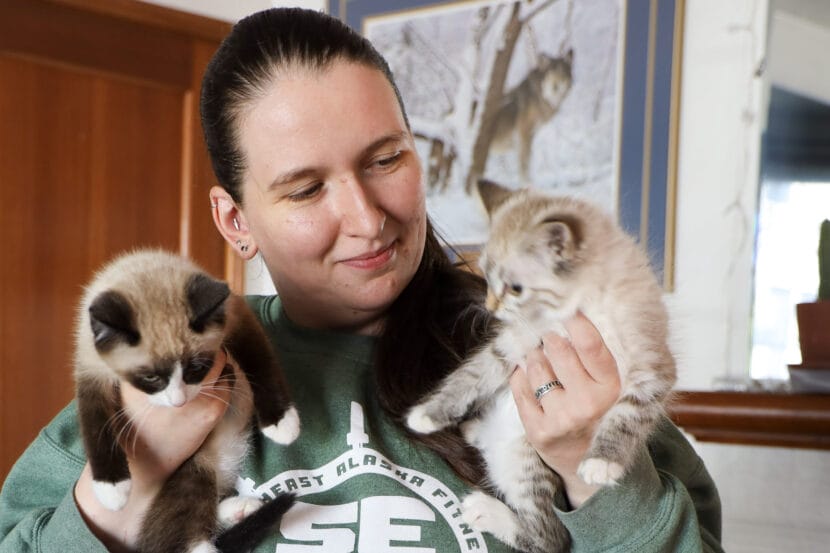 Tara Thornton holds her foster kittens Salish and Sedona on August 28, 2025. (Photo by Yvonne Krumrey/KTOO)