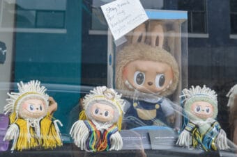 Three Labubus in Ravenstail weaving on display, while a gigantic fourth one awaits his, at master weaver Lily Hope's studio on Sept. 12, 2025. (Photo by Yvonne Krumrey/KTOO)