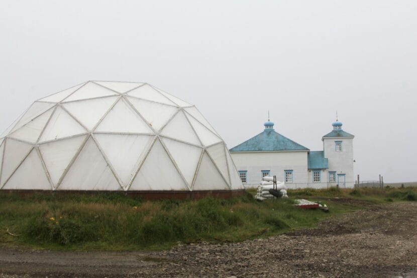 One of Nikolski's five greenhouse domes in front of St. Nicholas Church in August 2025.