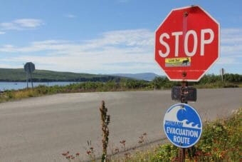 A sign marking a tsunami evacuation route in Sand Point, Alaska on July 29, 2025.