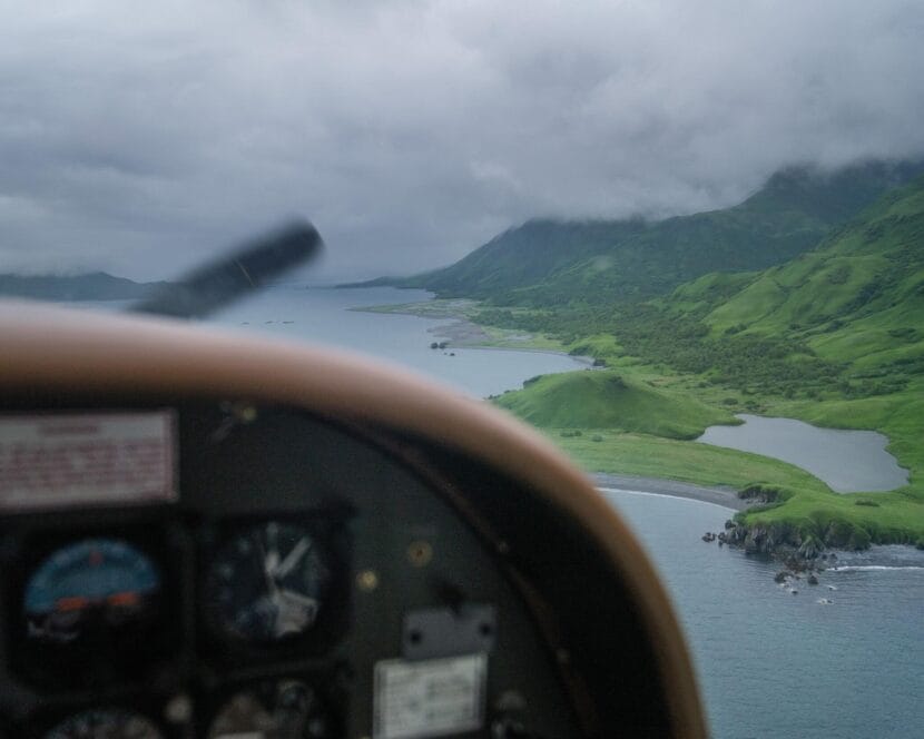 An Island Air Cessna Caravan flies toward Old Harbor, a village of about 200 people in the Kodiak Archipelago, July 2, 2024.