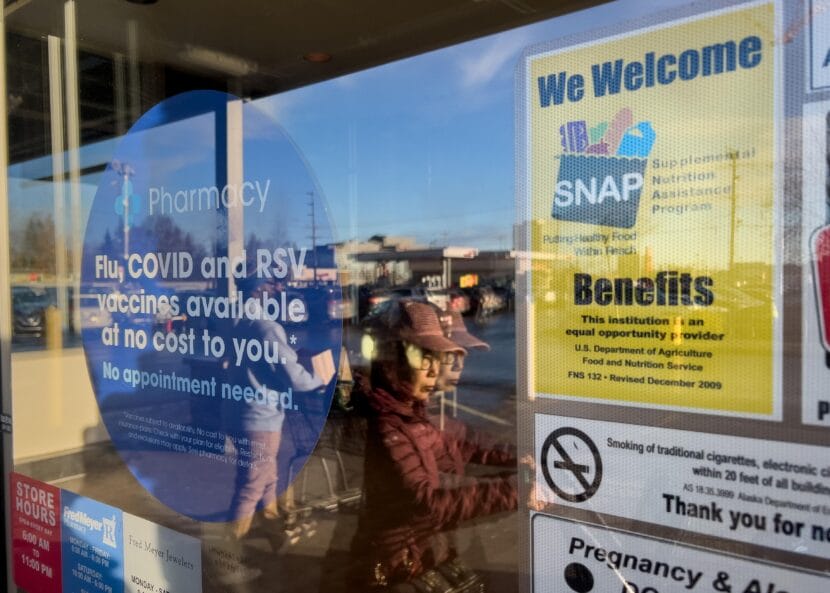 A shopper passes by a sign welcoming SNAP recipients at a Fred Meyer store in Anchorage on Monday, Nov. 3, 2025.