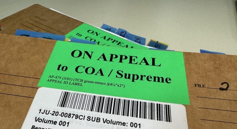 Case files for a legal matter referred to the Alaska Supreme Court are seen on Tuesday, Feb. 6, 2024, in Juneau.