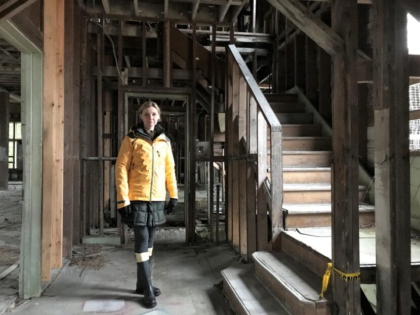 woman standing in unfinished house
