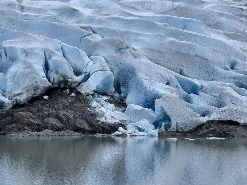 The center of Mendenhall Glacier's terminus on November 23, 2025. Scientists confirm glacier is no longer touching Mendenhall Lake. (Photo by Alix Soliman/KTOO)