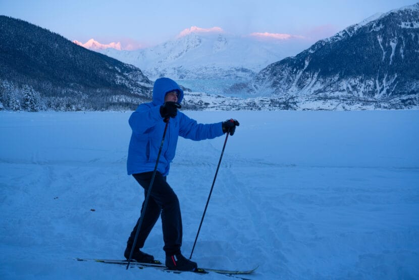 Mary Ann Parke sets off on a ski trail toward Mendenhall Campground as the sun sets on Dec. 21, 2025. (Photo by Alix Soliman/KTOO)