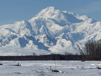 A large snowy mountain viewed on a clear day