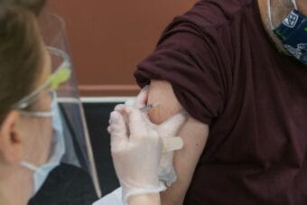 A patient receives the COVID-19 vaccine.
