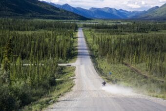A motorcyclist descends a hill as he approaches Coldfoot, Alaska on the Dalton Highway in 2014.