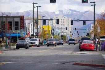 Cars are driven on Fourth Avenue in downtown Anchorage on Oct. 7, 2024.