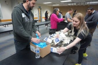 Jeff Toole and Bernadette Hartley help assemble kits containing naloxone, a drug that reverses opioid overdoses, at a Aug. 29, 2025 event in Anchorage. The volunteer event held at the Fairview Community Recreation Center was organized by the Alaska Department of Health's Project HOPE and the Alaska Native Tribal Health Consortium. Wider distribution of the naloxone kits may have contributed to a decreate in overdose deaths.