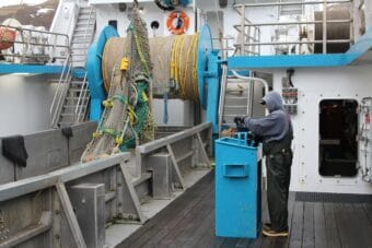 A crewmember on the fishing vessel Progress wraps up the 2025 pollock season in Unalaska. A storm caused millions of dollars in damage to the 130-foot trawler during the 2018 fishing season. Those kinds of incidents are rare, thanks in part to NOAA's marine forecast service.