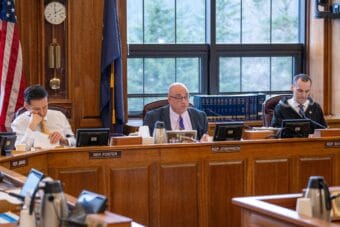 Rep. Andy Josephson, center, speaks during a House Finance Committee meeting alongside co-chairs Rep. Neal Foster, D-Nome, left, and Rep. Calvin Schrage, I-Anchorage, right, on Feb. 13, 2026.