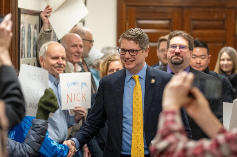 Alaska Congressman Nick Begich shakes hands with a support