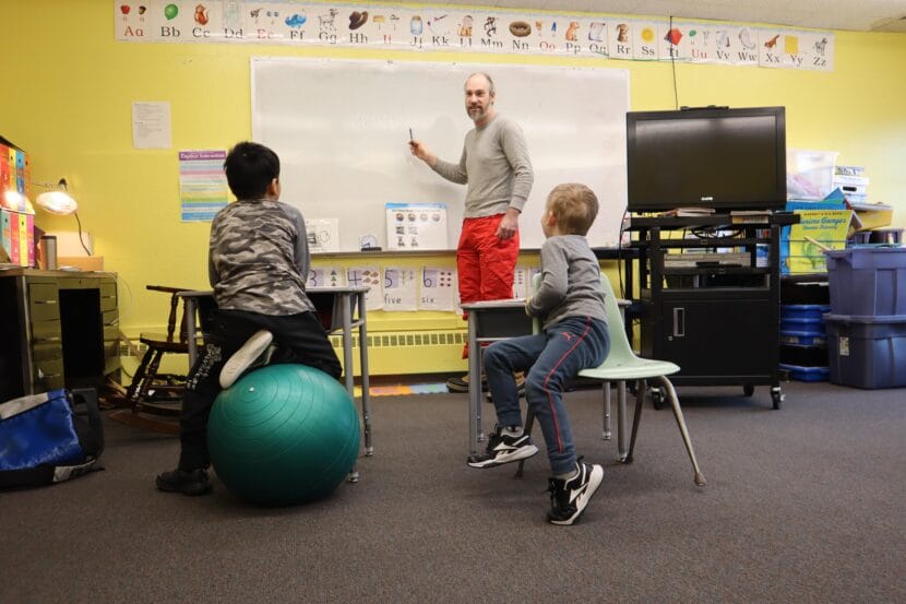 Brian Smith teaches students at the school in Sleetmute in 2024, which has suffered from a leaky roof and structural problems as a result. One lawmaker has labeled the school “the poster child” for what’s wrong with the state’s public school infrastructure.