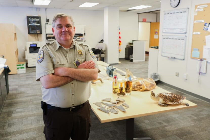 Chris Andrews with some samples of confiscated goods in his office at the Ted Steven Anchorage International Airport on June 4, 2026. Andrews says he never knows what he's going to find next.