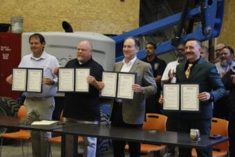 From left, Alaska Petroleum Joint Crafts Council President Joey Merrick, Fairbanks Building and Construction Trades Council President Lake Williams, 8 Star Alaska LLC Co-President Rex Canon and Building and Construction Trades Council of Southcentral Alaska President Bronson Frye pose with signed copies of an agreement to maximize the use of in-state labor on a gas pipeline project at an event in Chugiak on Thursday, June 11, 2026.
